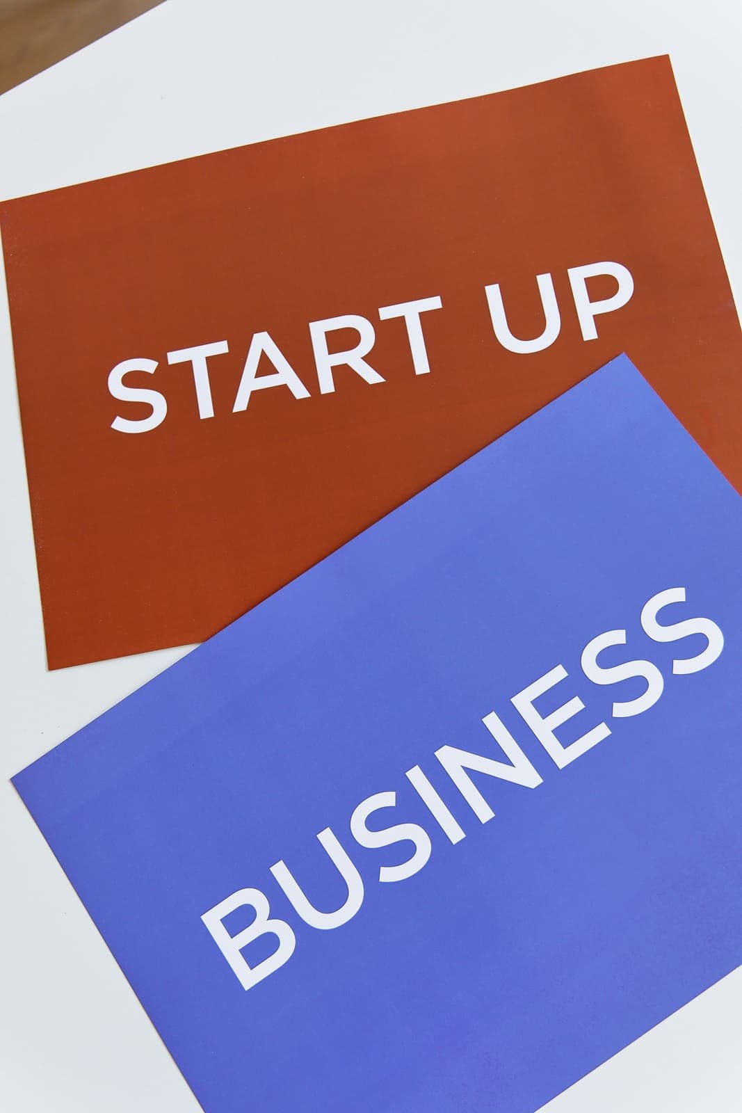 Colorful START UP and BUSINESS typography cards representing entrepreneurial beginnings