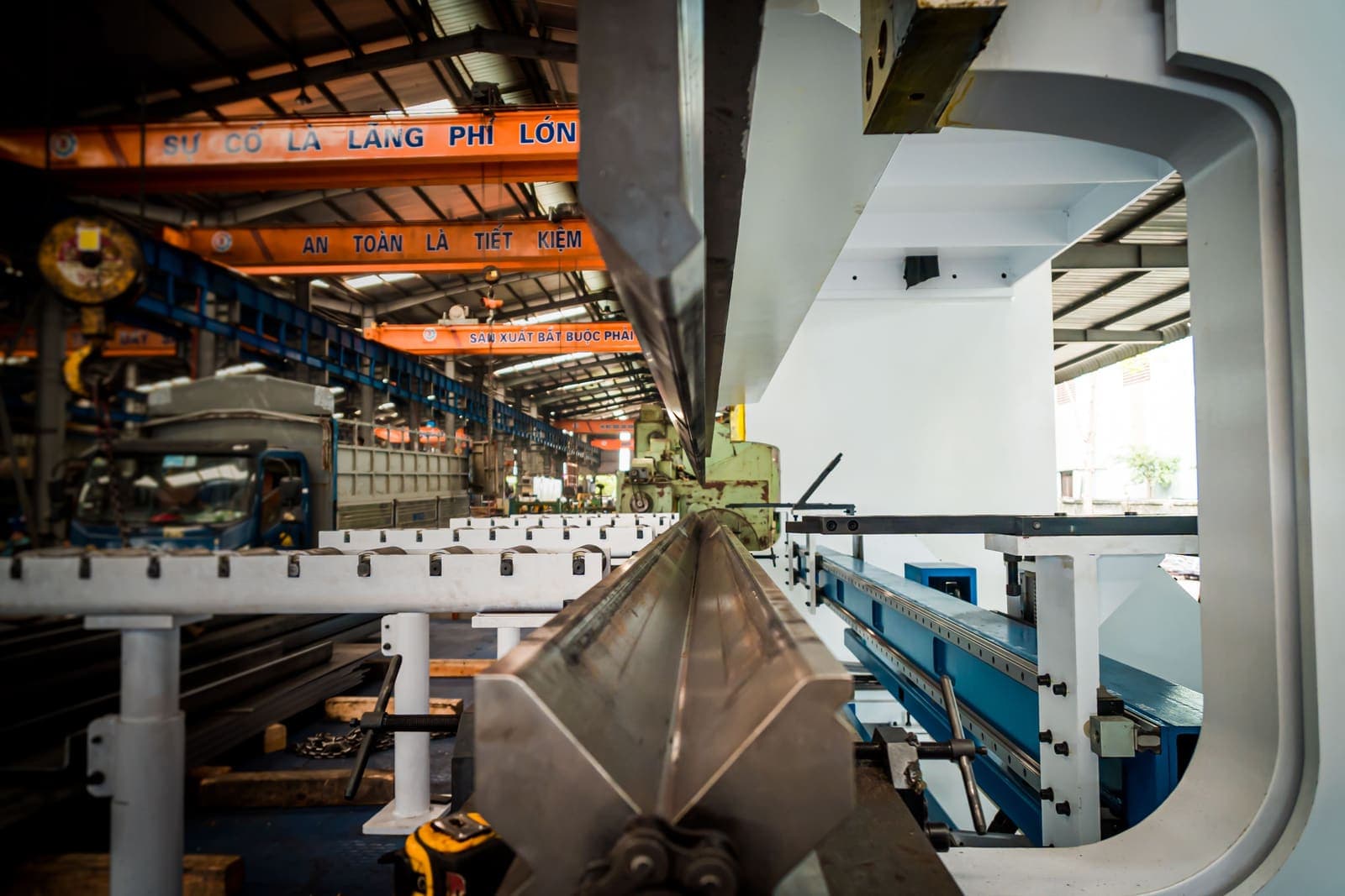 Industrial manufacturing floor with overhead crane and precision machinery — representing the breadth of industries Unicornin60 serves